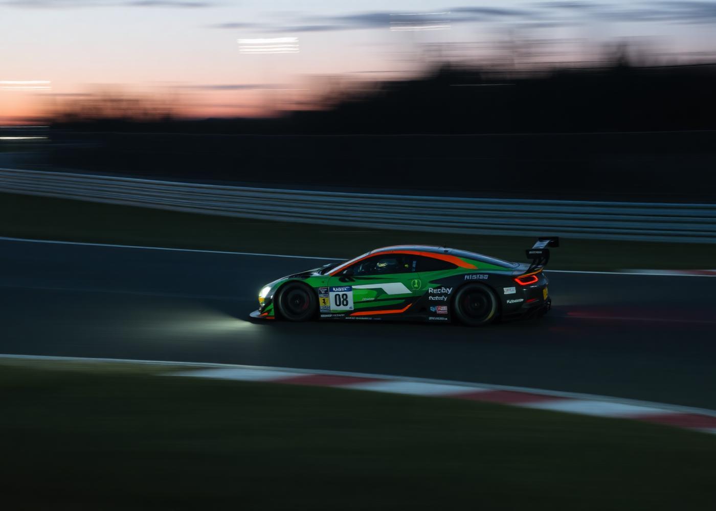 Race car on track at dusk